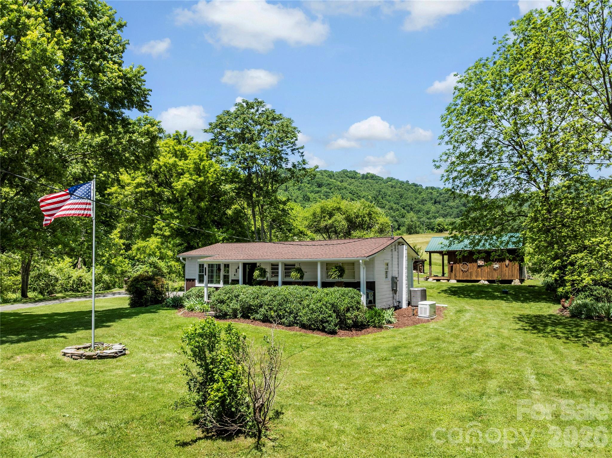 514 Roy Forrester Road Mars Hill, NC 28754 - Photo 2 of 25 a house view with a garden space