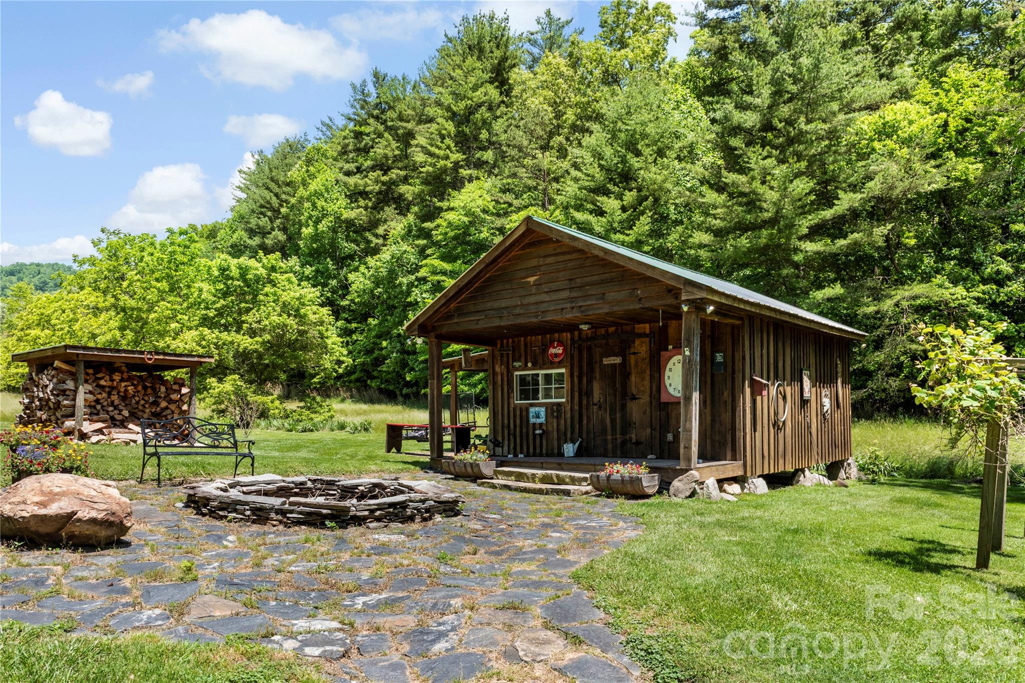 514 Roy Forrester Road Mars Hill, NC 28754 - Photo 21 of 25 a backyard of a house with barbeque oven