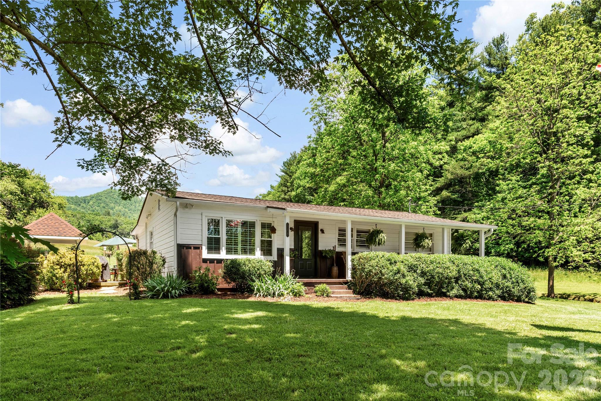 514 Roy Forrester Road Mars Hill, NC 28754 - Photo 3 of 25 a front view of a house with a yard
