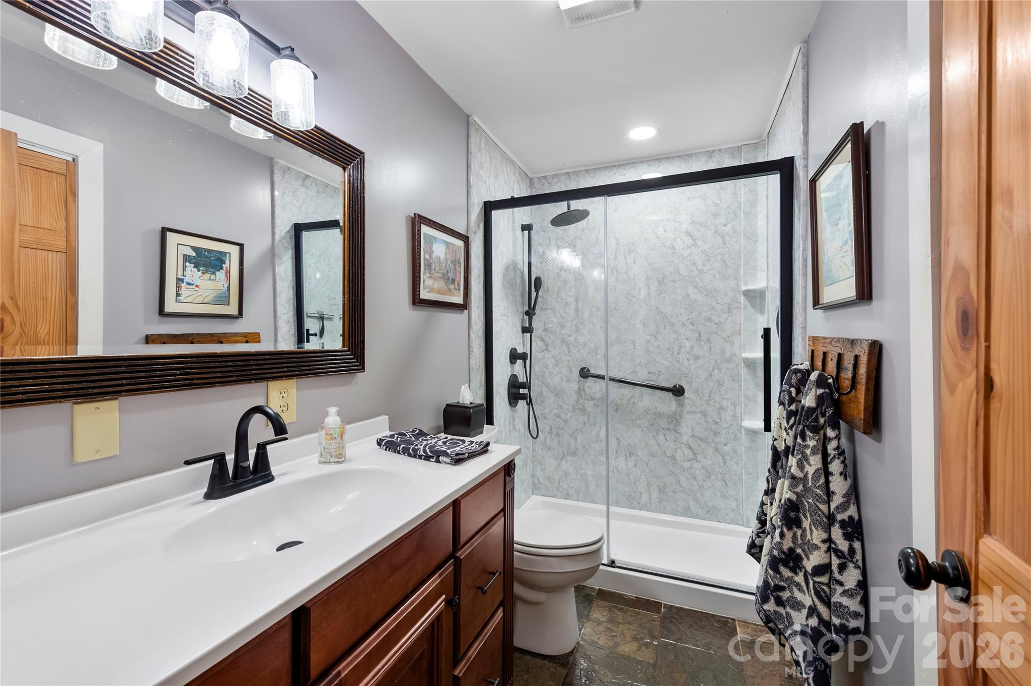 514 Roy Forrester Road Mars Hill, NC 28754 - Photo 8 of 25 a bathroom with a sink toilet and shower