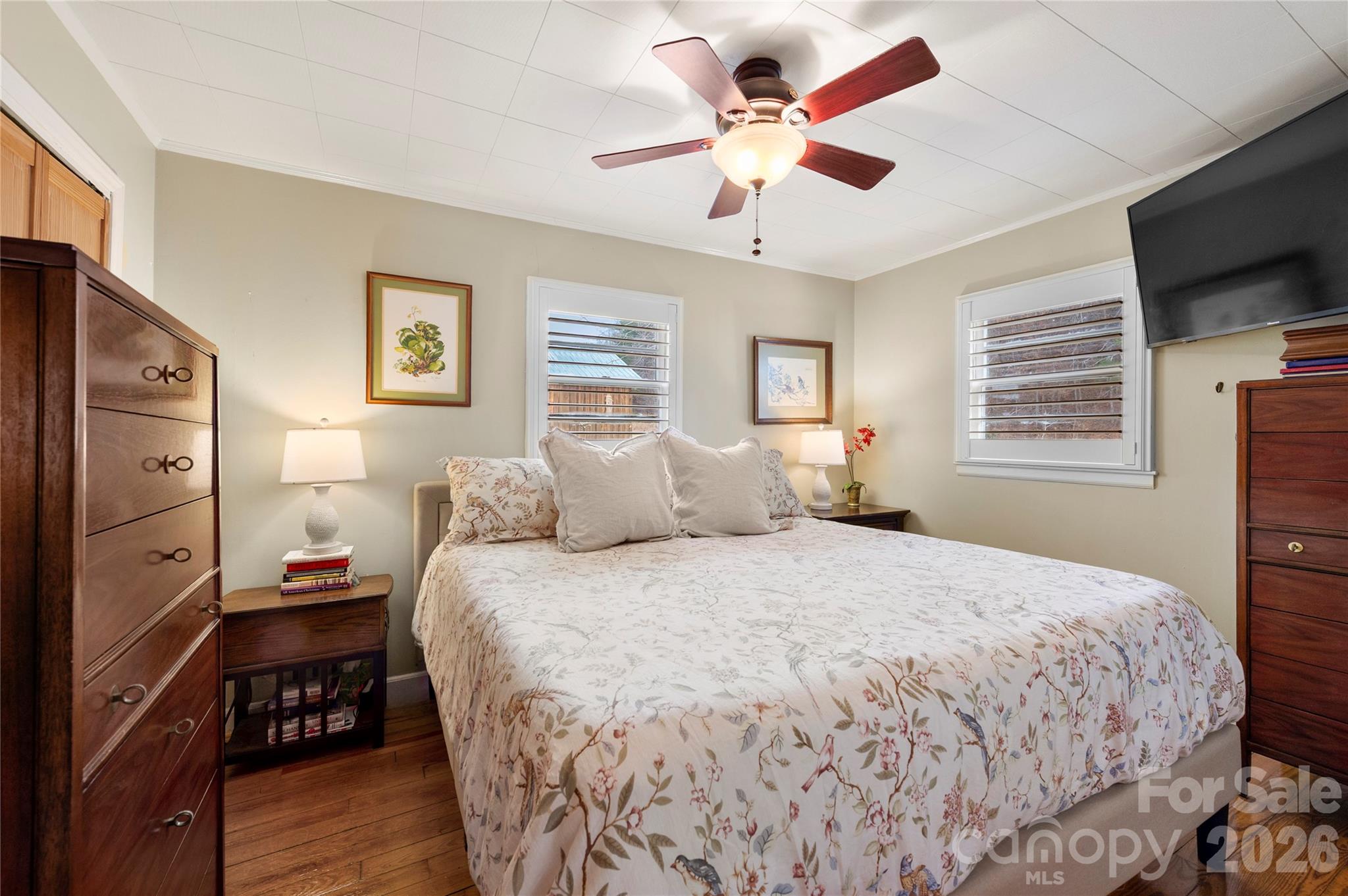 514 Roy Forrester Road Mars Hill, NC 28754 - Photo 9 of 25 a bedroom with a bed and a flat screen tv