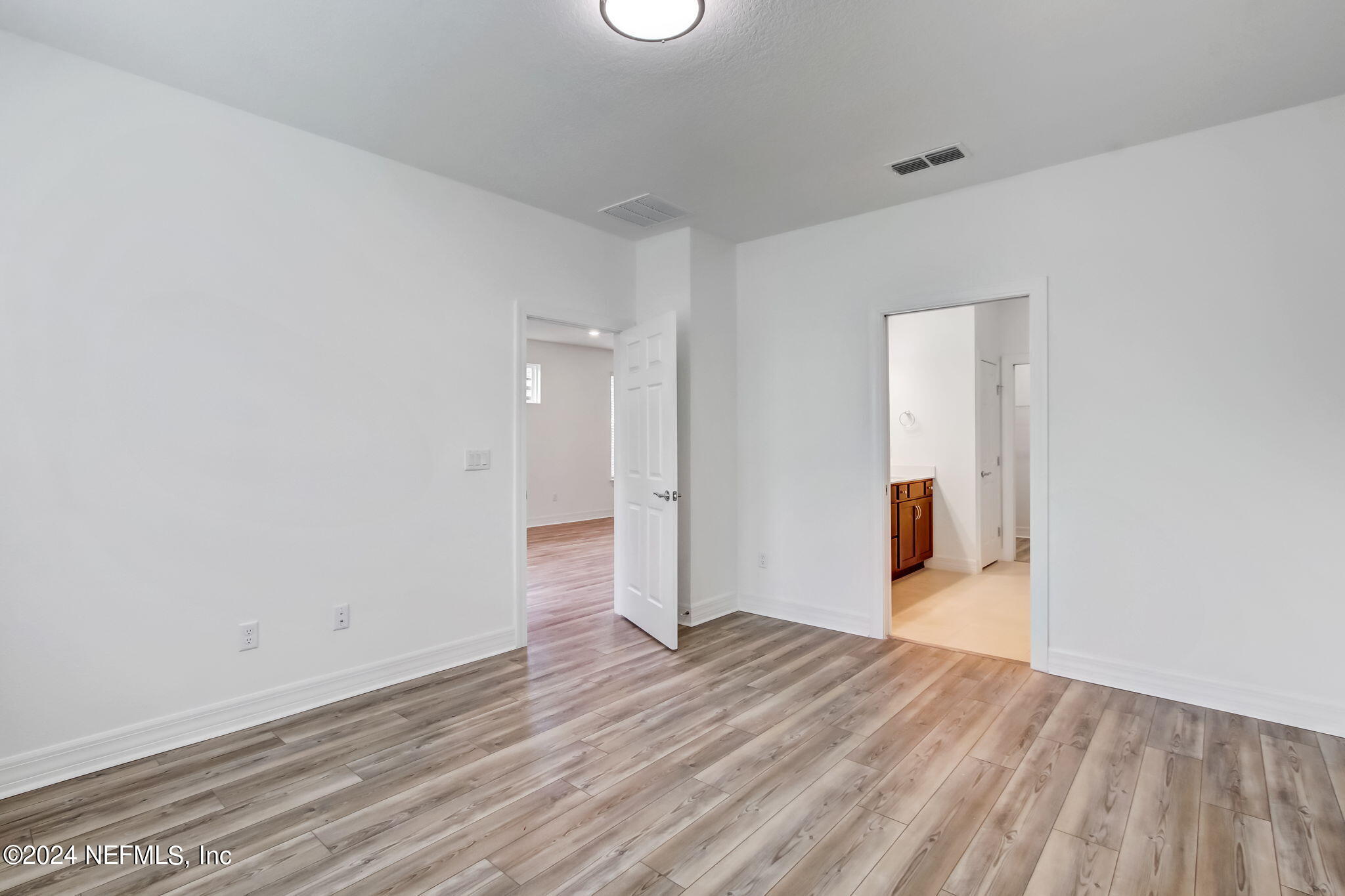 524 Jubilee Circle Yulee, FL 32097 - Photo 11 of 25 a view of a room with wooden floor