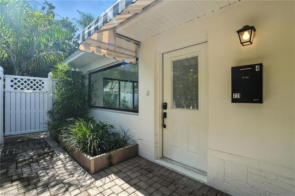 721 9th Street South, Unit 4 Naples, FL 34102 - Photo 4 of 8 a front view of a house