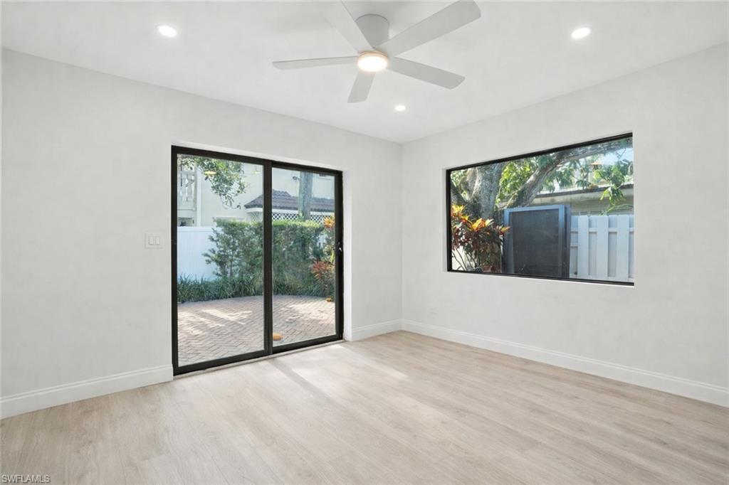 721 9th Street South, Unit 4 Naples, FL 34102 - Photo 8 of 8 en empty room with large window