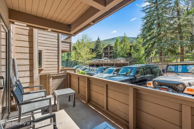a view of a two chairs in the balcony