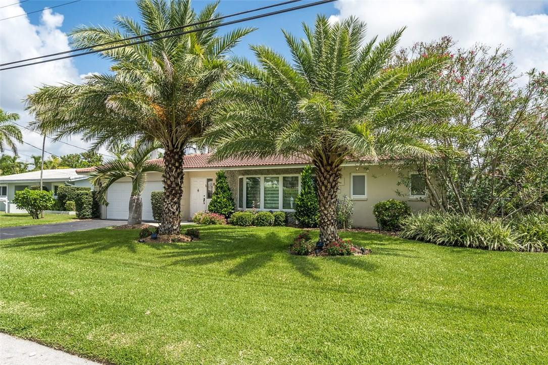 807 Berkley Street Boca Raton, FL 33487 - Photo 1 of 34 a backyard of a house with seating space