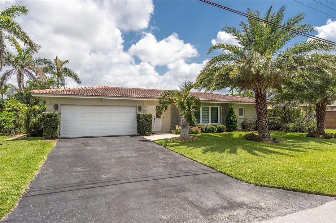 807 Berkley Street Boca Raton, FL 33487 - Photo 3 of 34 a front view of a house with a yard and porch