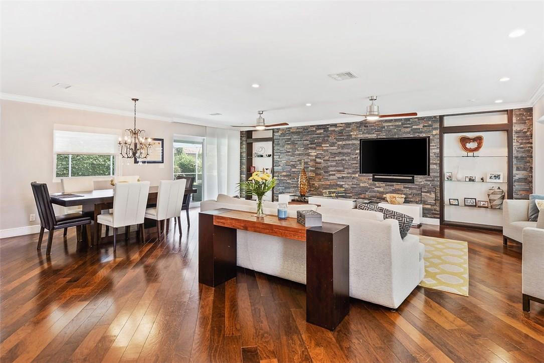 807 Berkley Street Boca Raton, FL 33487 - Photo 6 of 34 a living room with fireplace furniture and a flat screen tv