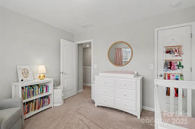 a bedroom with a bed and a book shelf