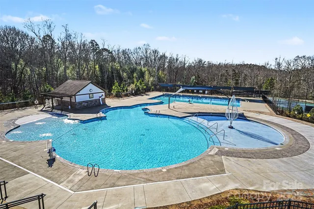 a view of a swimming pool with an outdoor seating