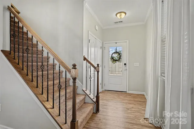 a view of an entryway with wooden floor