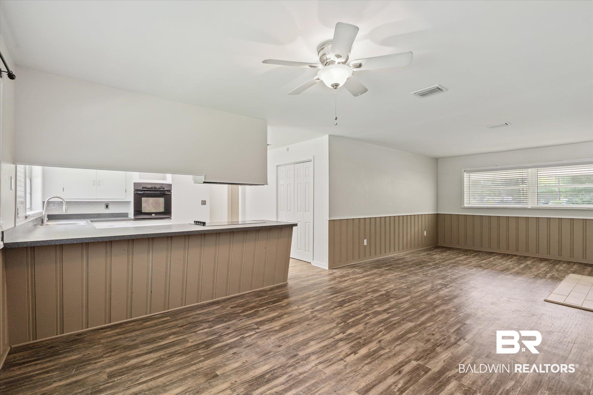 3325 Lacoste Road Mobile, AL 36618 - Photo 7 of 35 Interior space with ceiling fan, sink, and dark hardwood / wood-style flooring