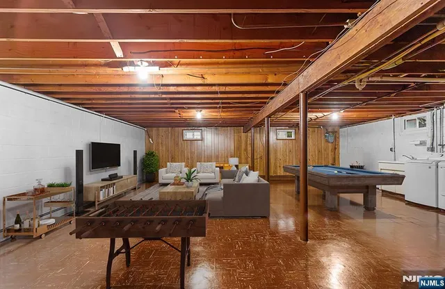 a living room with lots of furniture and a flat screen tv