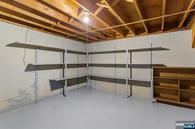 a view of an empty room with a staircase