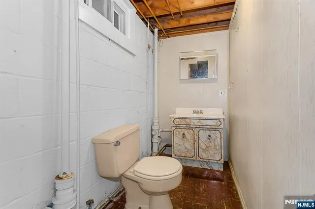 a bathroom with a toilet a sink and a shower