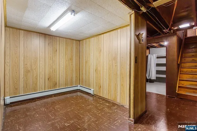 a view of a room with wooden walls