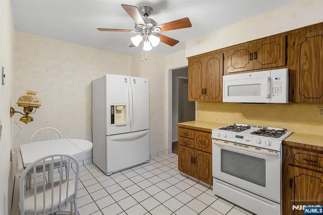 a kitchen with a stove and a refrigerator