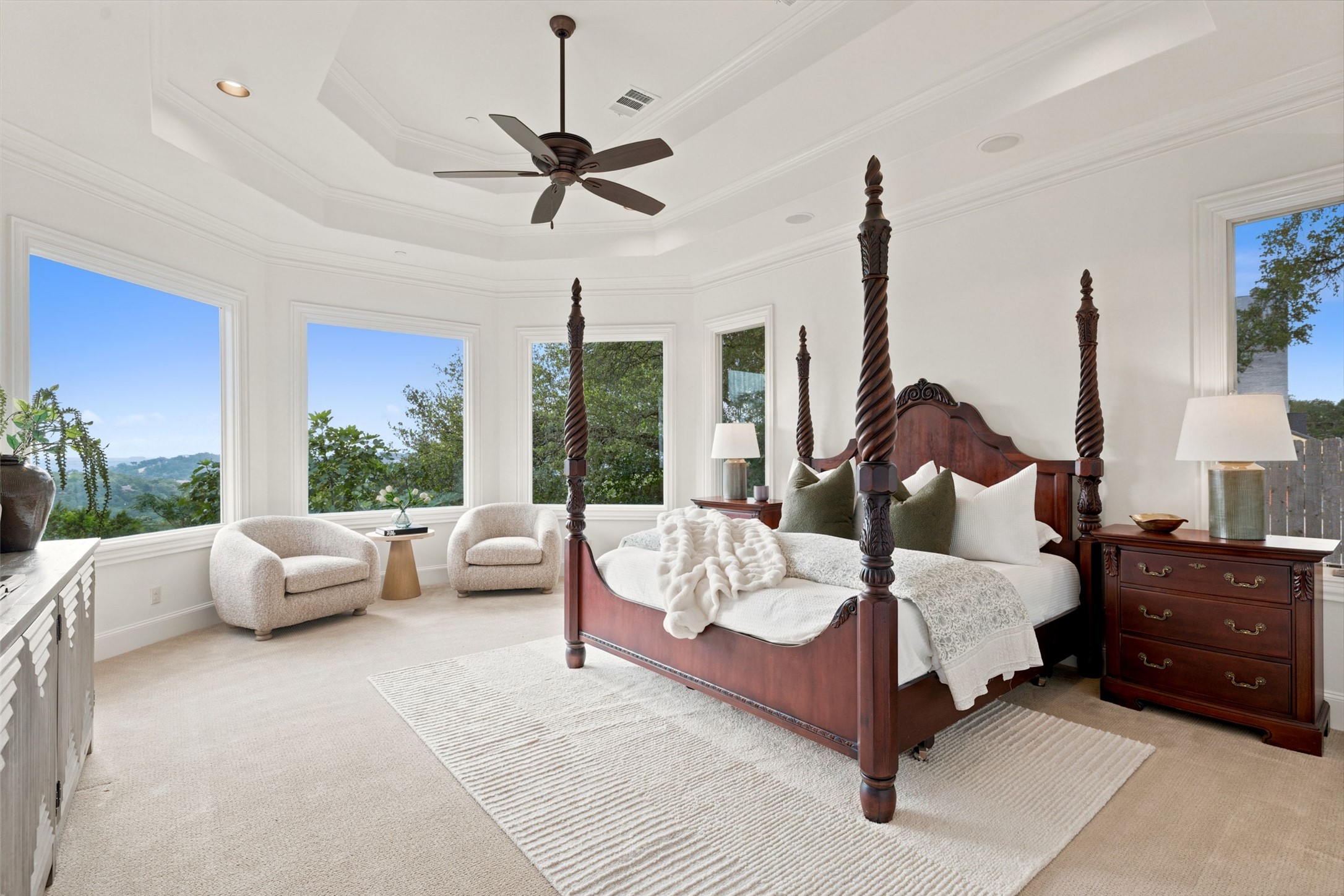 1414 The High Road Austin, TX 78746 - Photo 18 of 40 A tranquil retreat, this bedroom offers sweeping views and a high tray ceiling.