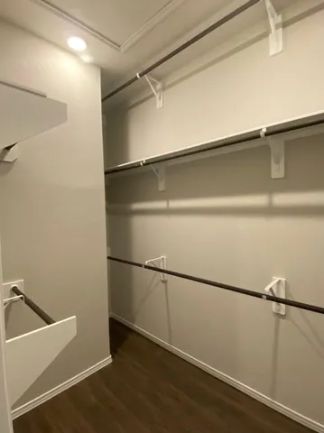 a view of an empty walk in closet