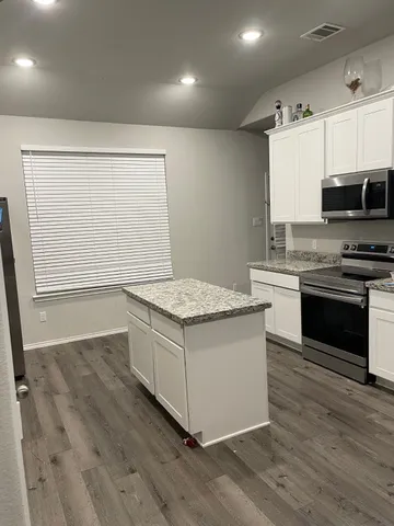 a kitchen with a stove and a sink