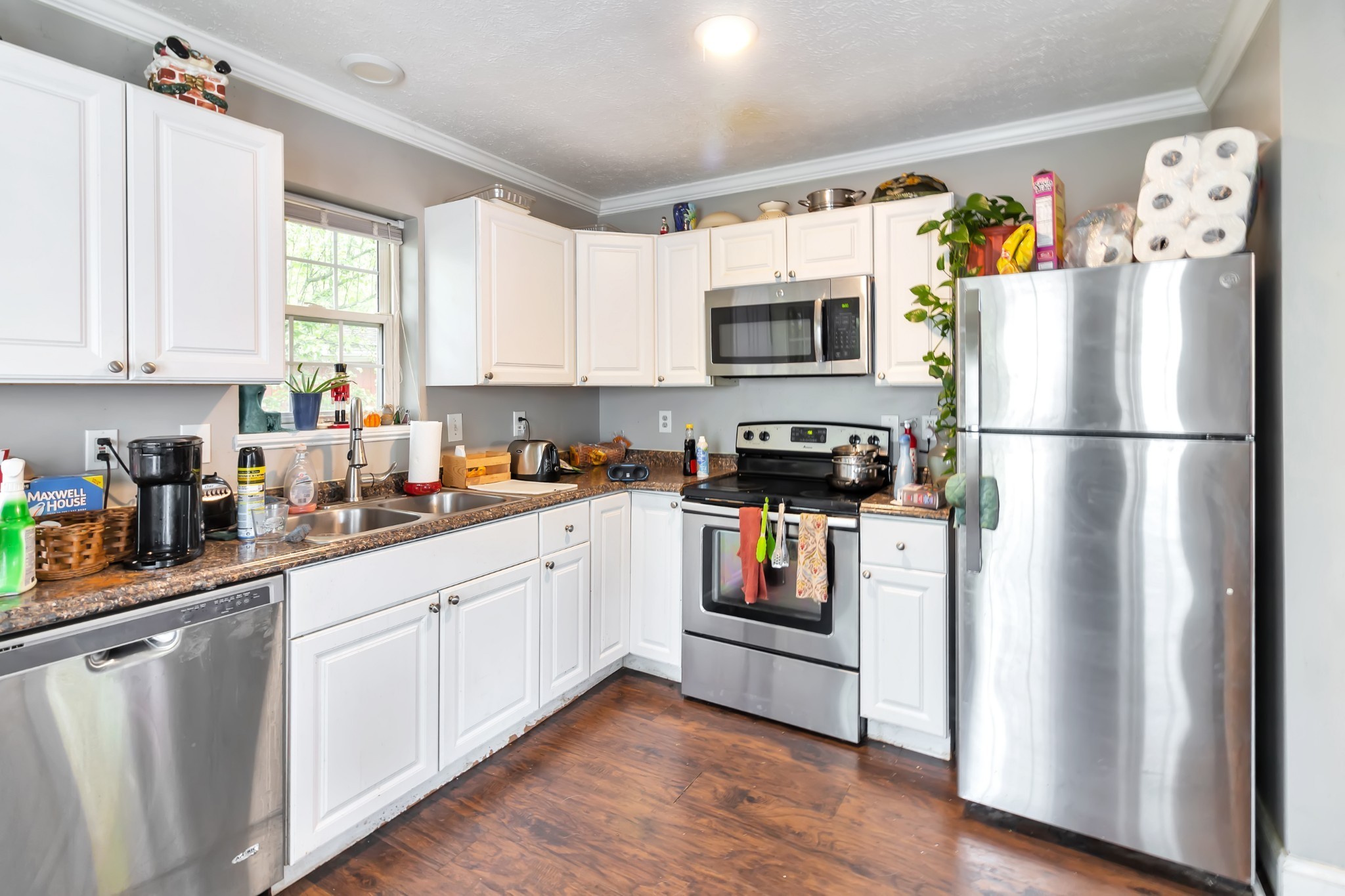 521 Rothwood Avenue Madison, TN 37115 - Photo 5 of 5 a kitchen with stainless steel appliances a refrigerator sink and microwave