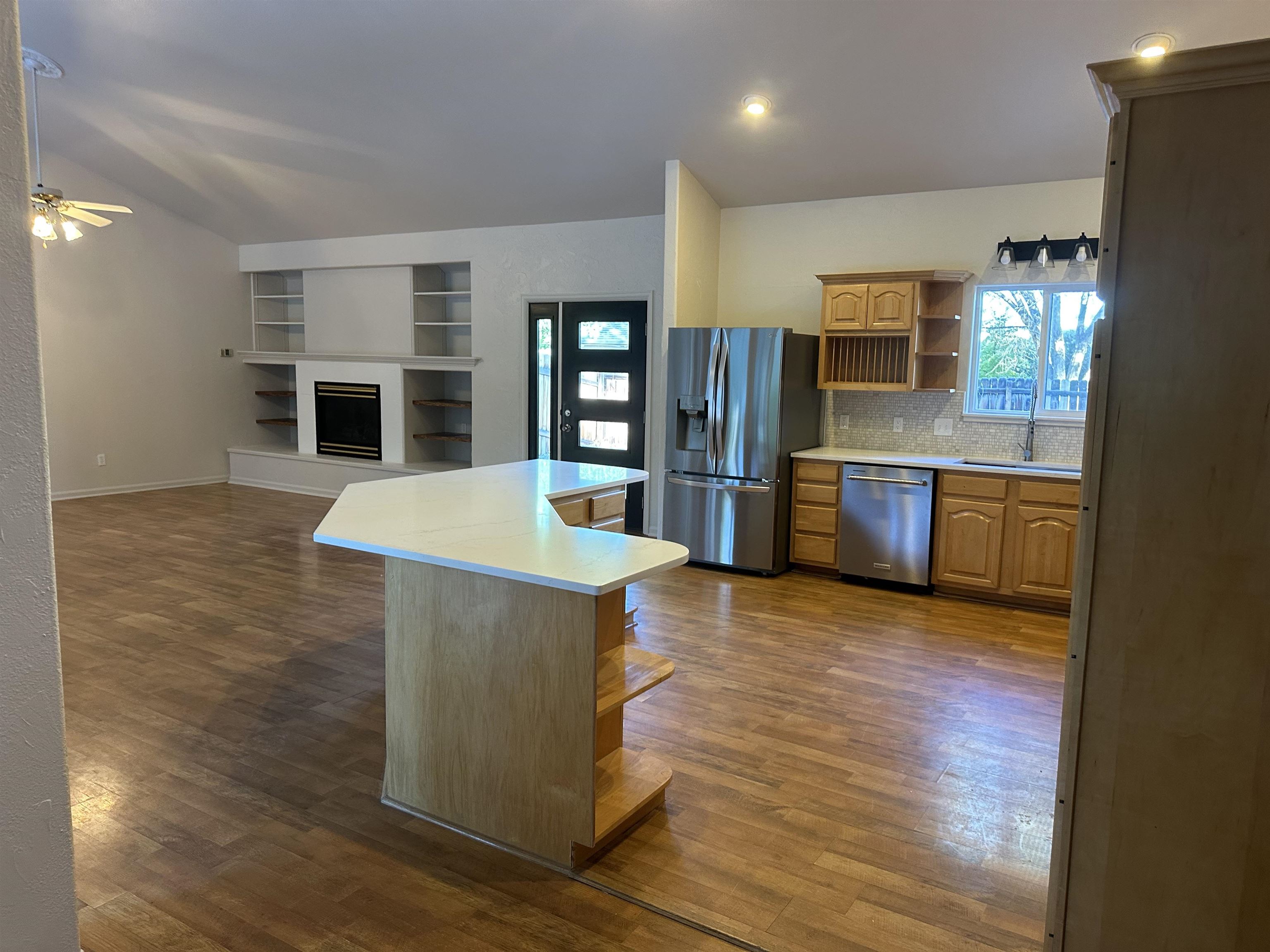 2678 Cambridge Road Grand Junction, CO 81506 - Photo 17 of 32 a view of kitchen with stainless steel appliances granite countertop a stove top oven a sink dishwasher and a refrigerator