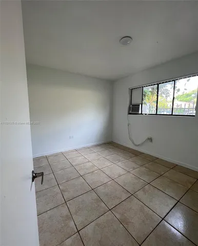 a white refrigerator freezer and a microwave in a kitchen