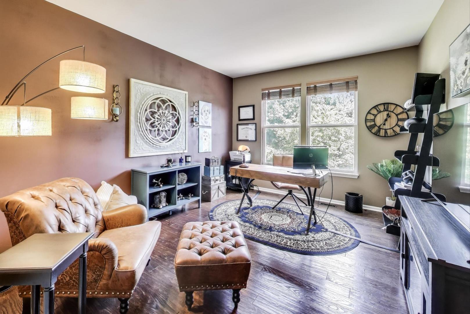 705 Porter Circle Lindenhurst, IL 60046 - Photo 11 of 34 a living room with furniture a rug and a large window