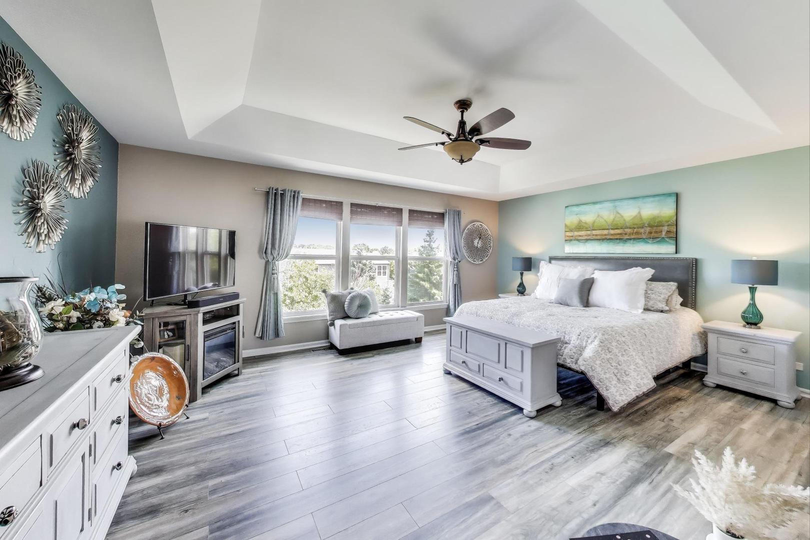 705 Porter Circle Lindenhurst, IL 60046 - Photo 13 of 34 a spacious bedroom with a bed and a flat screen tv