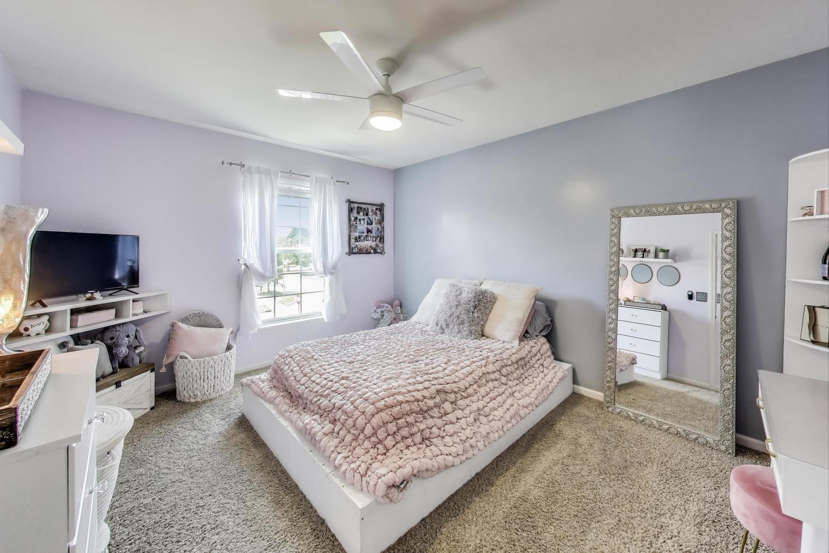 705 Porter Circle Lindenhurst, IL 60046 - Photo 19 of 34 a bedroom with a bed and a flat screen tv