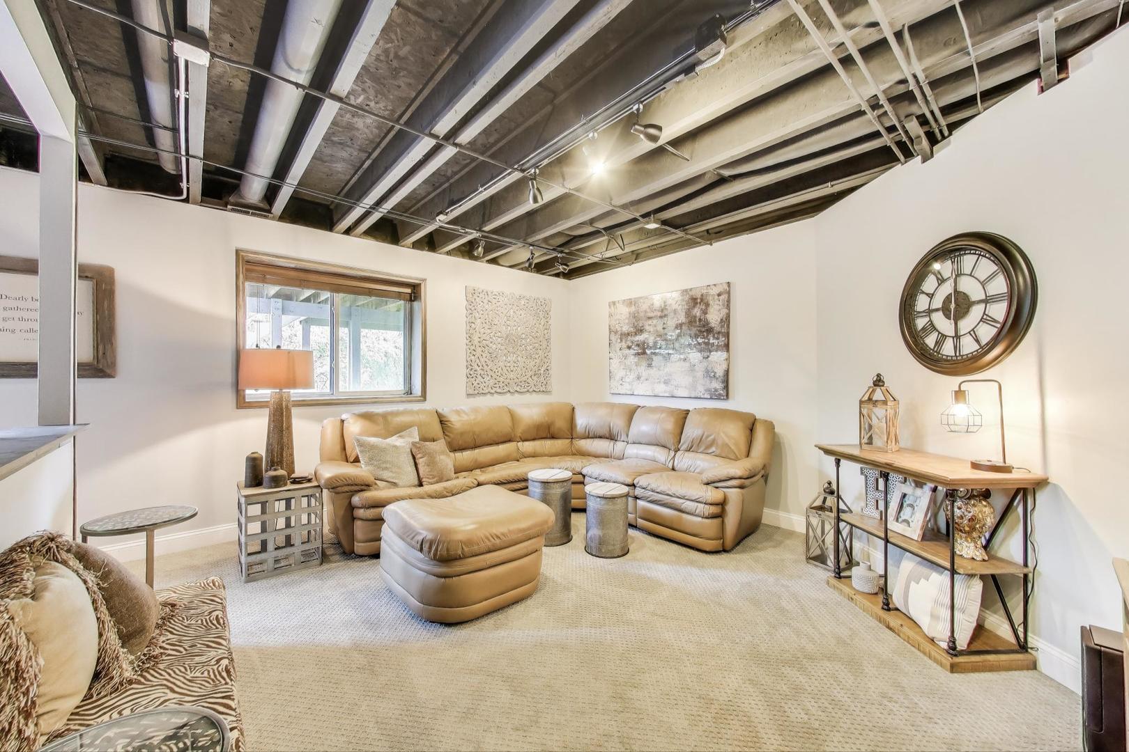 705 Porter Circle Lindenhurst, IL 60046 - Photo 23 of 34 a living room with furniture a clock and a window