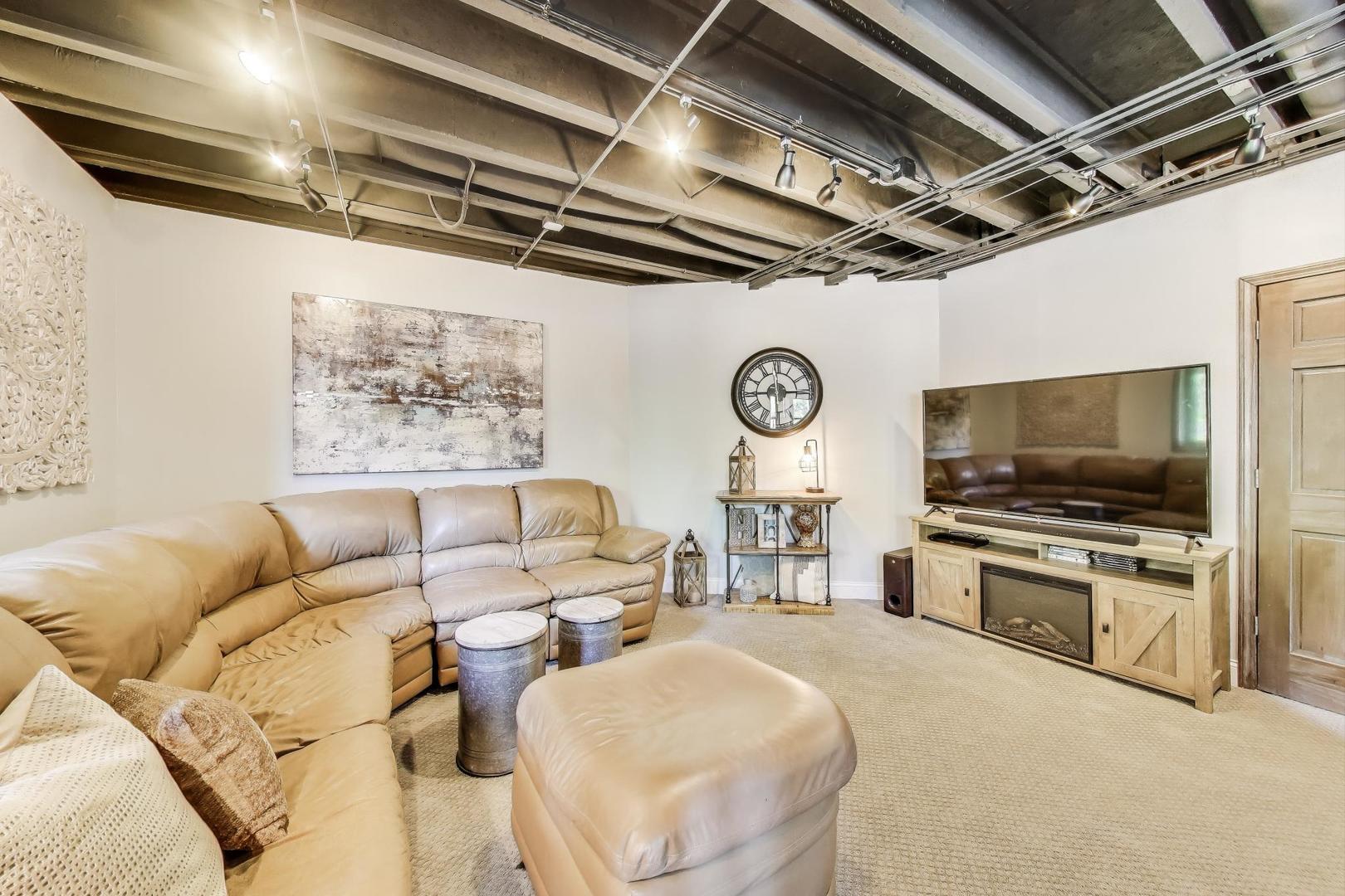 705 Porter Circle Lindenhurst, IL 60046 - Photo 24 of 34 a living room with furniture and a flat screen tv