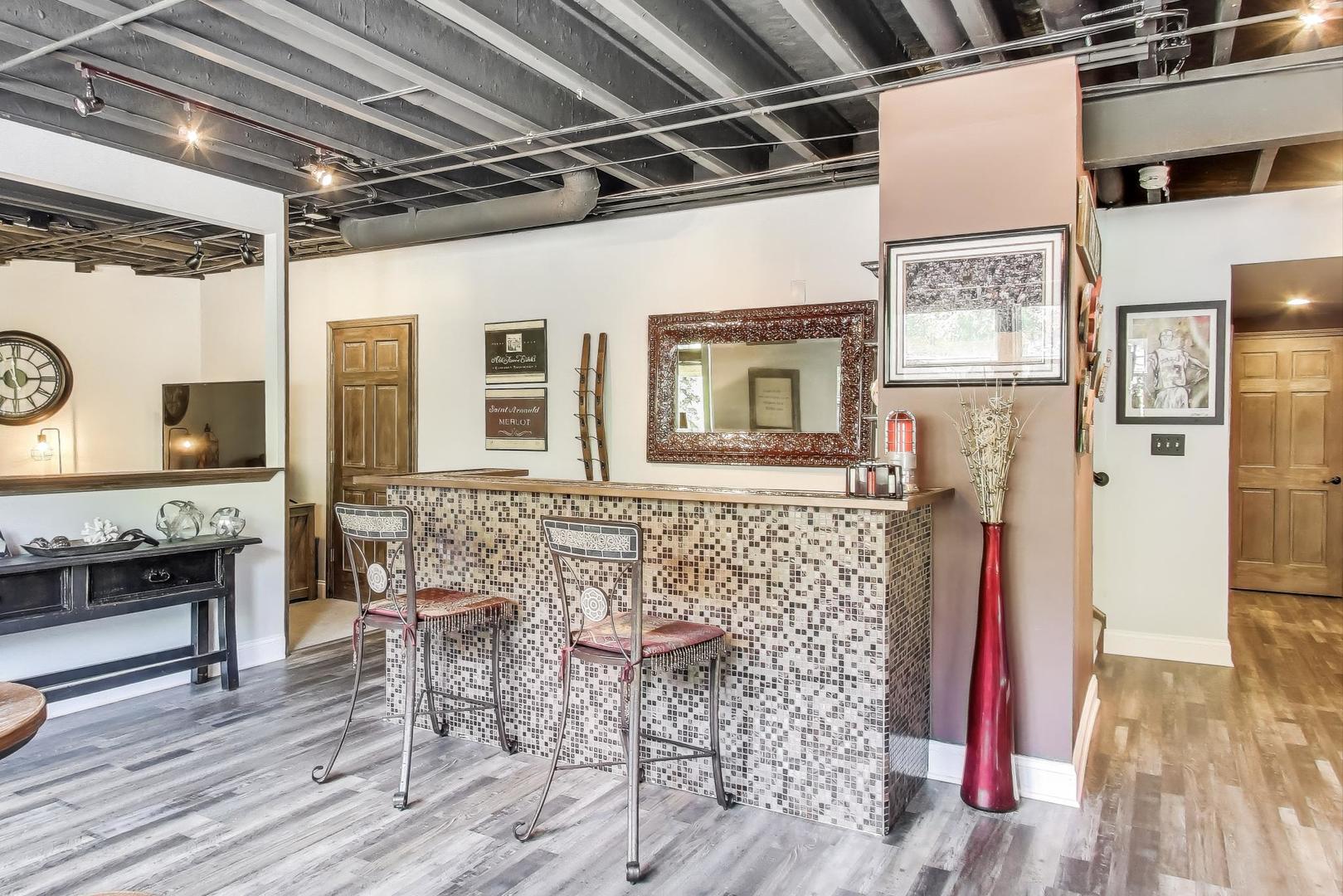 705 Porter Circle Lindenhurst, IL 60046 - Photo 27 of 34 a view of a livingroom with furniture a flat screen tv and wooden floor