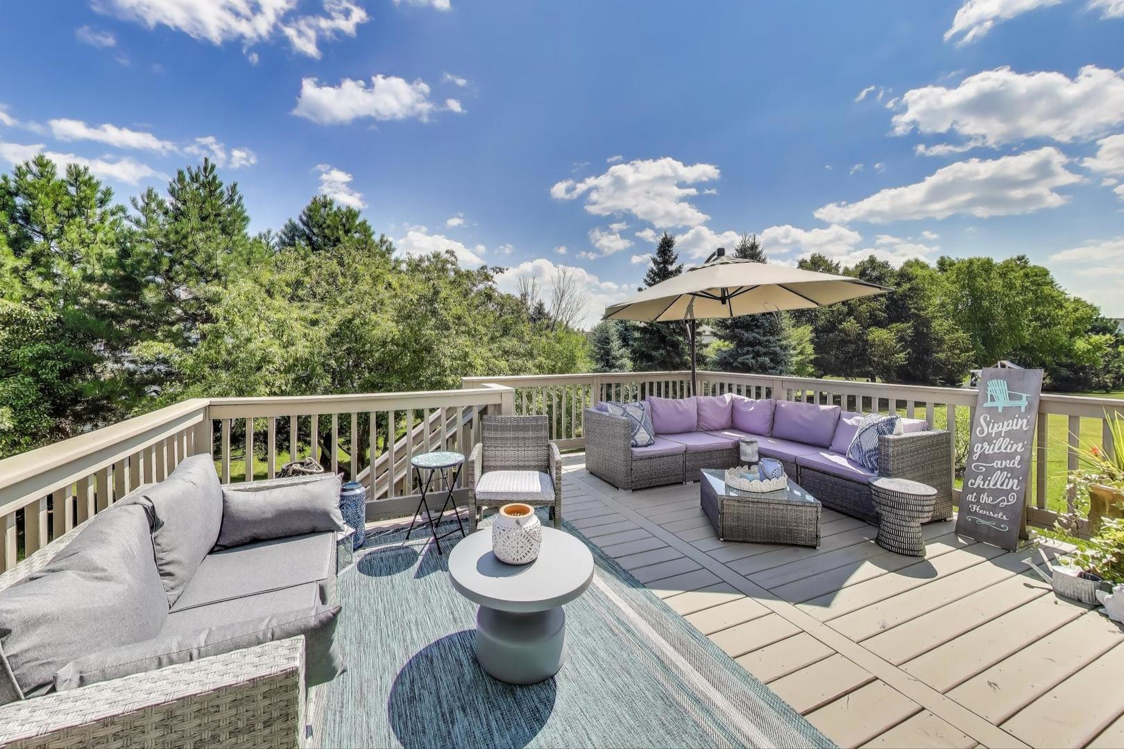 705 Porter Circle Lindenhurst, IL 60046 - Photo 30 of 34 a view of a deck with couches table and chairs