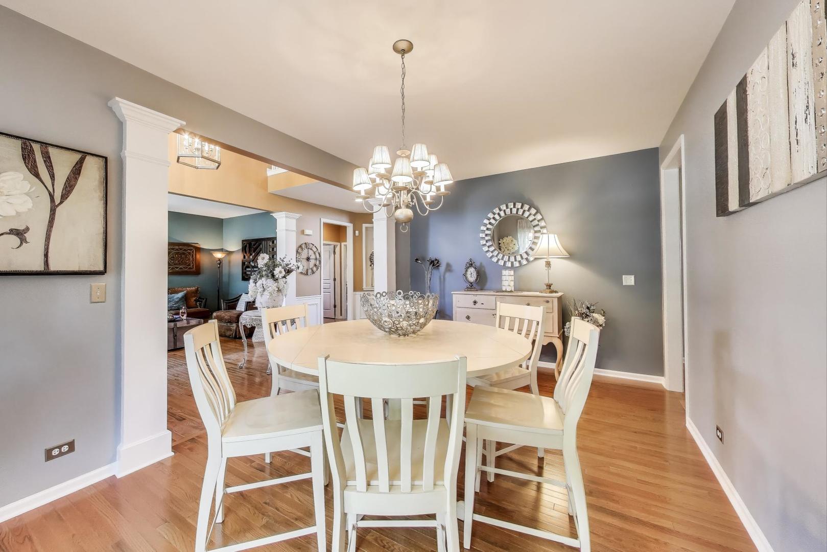 705 Porter Circle Lindenhurst, IL 60046 - Photo 4 of 34 a view of a dining room with furniture and chandelier