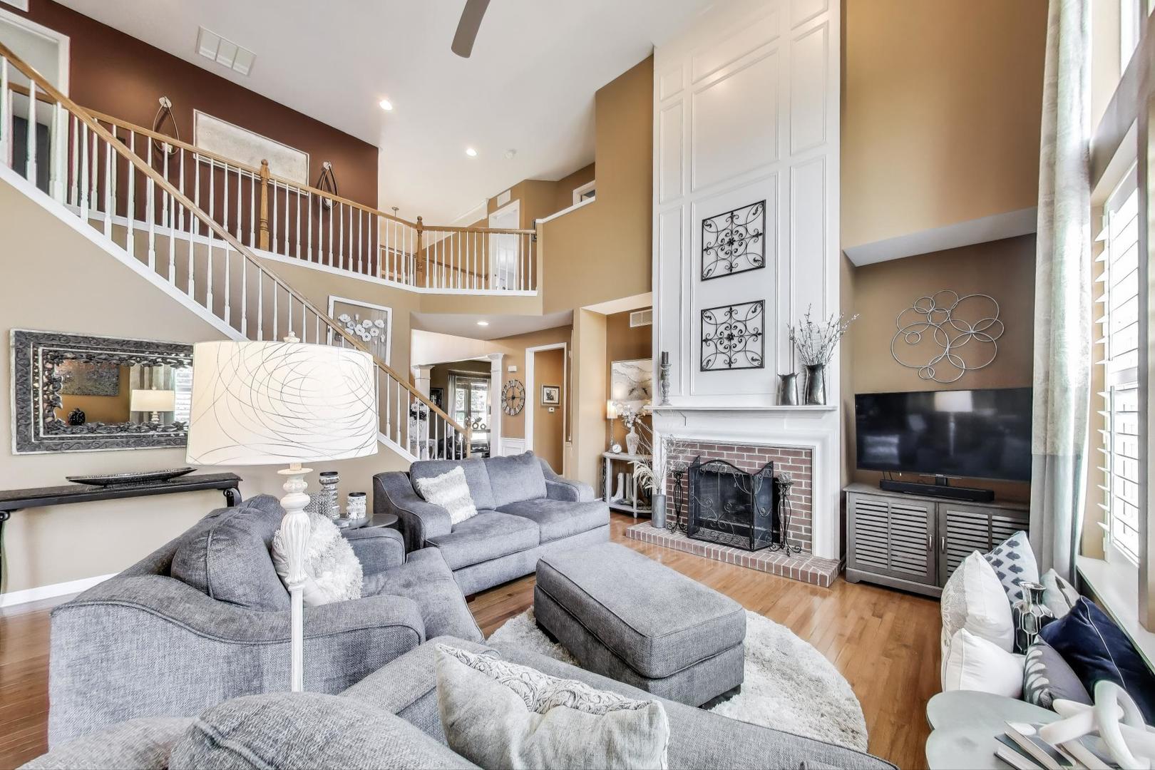 705 Porter Circle Lindenhurst, IL 60046 - Photo 9 of 34 a living room with furniture fireplace and flat screen tv