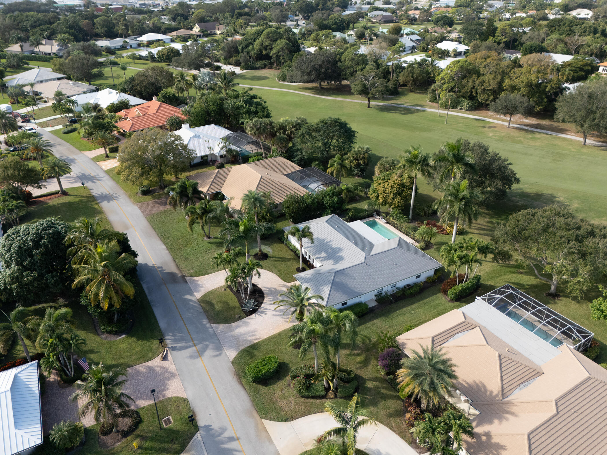 3201 Southeast Fairway West Stuart, FL 34997 - Photo 52 of 59 an aerial view of residential houses with outdoor space and trees