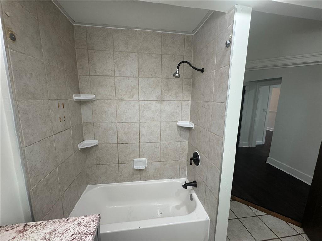 815 Braddock Road Pittsburgh, PA 15221 - Photo 22 of 36 a bathroom with a bathtub and shower