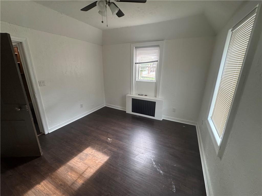 815 Braddock Road Pittsburgh, PA 15221 - Photo 24 of 36 an empty room with wooden floor and windows