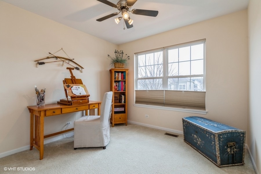 560 Lancaster Drive Pingree Grove, IL 60140 - Photo 15 of 26 a living room with furniture and a window