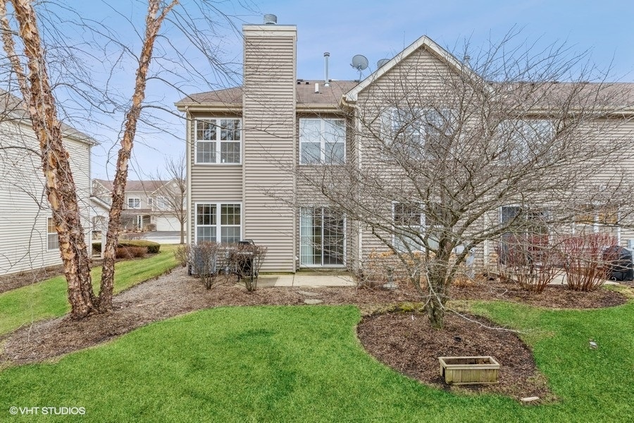 560 Lancaster Drive Pingree Grove, IL 60140 - Photo 17 of 26 front view of a house with a yard