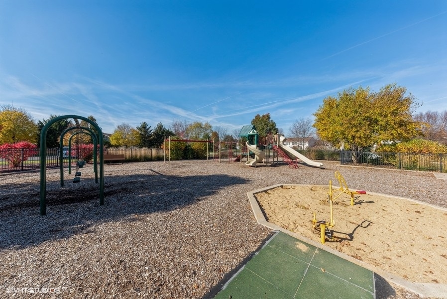 560 Lancaster Drive Pingree Grove, IL 60140 - Photo 23 of 26 a view of swimming pool with a slide