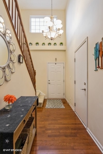 560 Lancaster Drive Pingree Grove, IL 60140 - Photo 4 of 26 a view of an entryway and chandelier