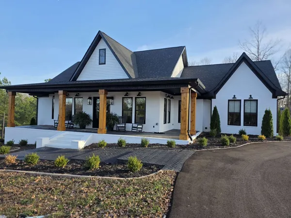 a view of a swimming pool with a lounge chair