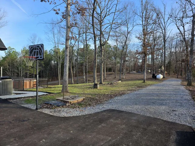 a backyard of a house with lots of green space