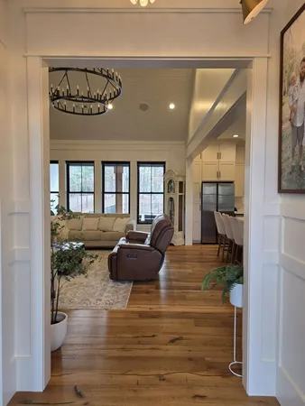 a view of a hallway with wooden shelves
