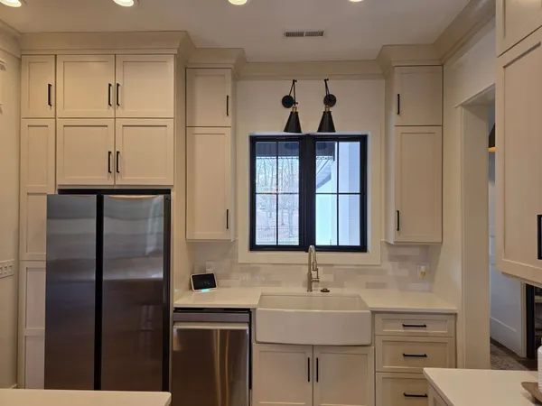 a bathroom with a sink double vanity and a mirror