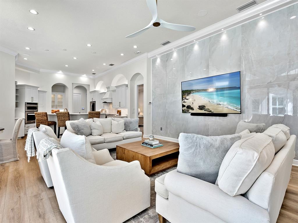 7431 Greystone Street Lakewood Ranch, FL 34202 - Photo 34 of 85 a living room with furniture and a flat screen tv