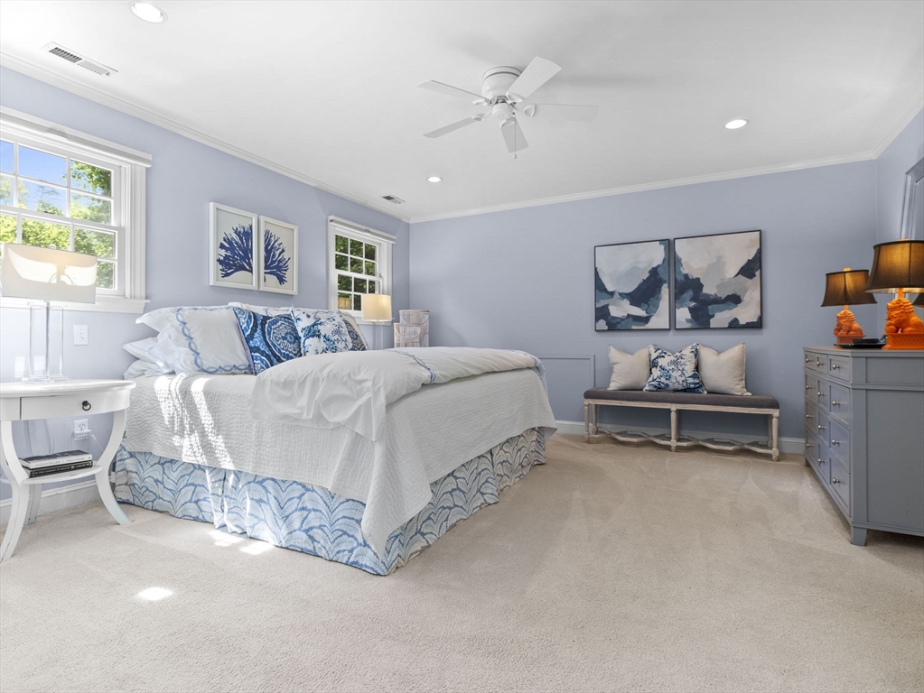 3 Dudley Road Wellesley, MA 02481 - Photo 13 of 25 a spacious bedroom with a bed a couch and paintings on the wall