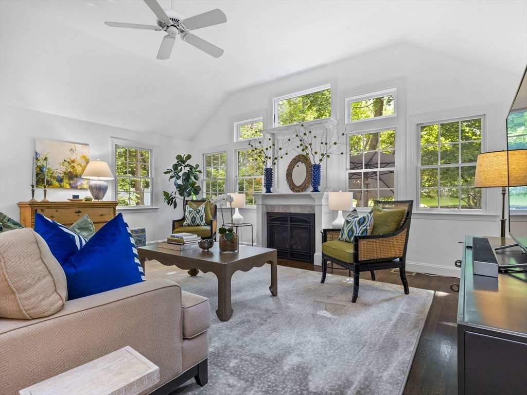 3 Dudley Road Wellesley, MA 02481 - Photo 3 of 25 a living room with furniture a fireplace and a large window